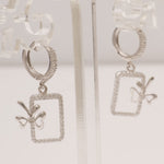 Load image into Gallery viewer, Geometric Bow Drop Huggie Earring