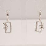 Load image into Gallery viewer, Geometric Bow Drop Huggie Earring