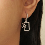 Load image into Gallery viewer, Geometric Bow Drop Huggie Earring
