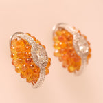Load image into Gallery viewer, Oval Cluster Orange Sapphire Halo Huggie Earrings

