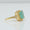 Load image into Gallery viewer, Green Emerald Cut Halo Diamond Ring
